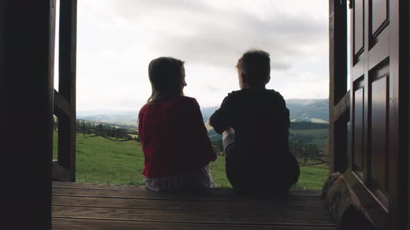 Kids Talking on House Porch