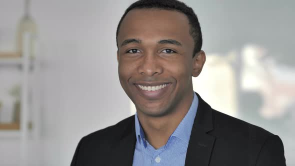 Portrait of Smiling Casual Afro-American Businessman Looking at Camera