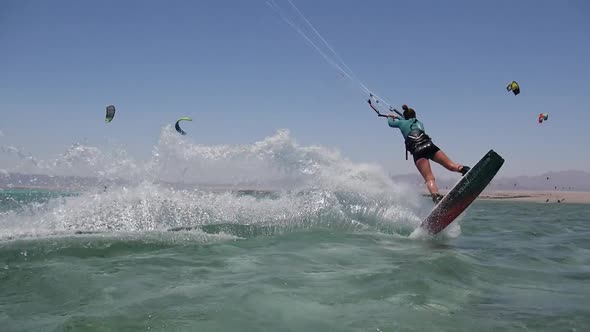 A young woman kiteboarding in Egypt.