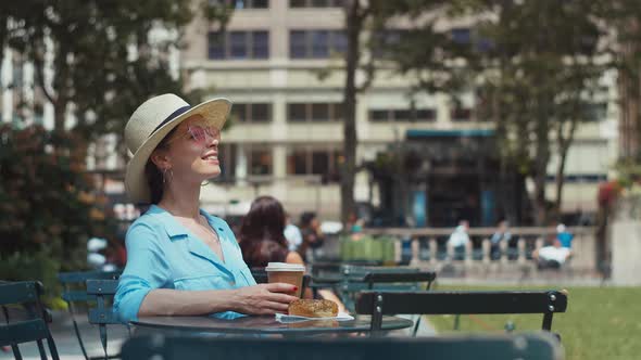 Happy girl at the table in park