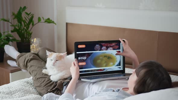 Delivery Restaurant, Girl Uses Her Laptop To Order Ready-made Meals Online Using Modern Customer