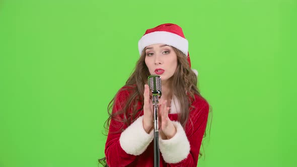 Snow Maiden Sings in a Retro Microphone and Dances with Energetic Music. Green Screen. Slow Motion