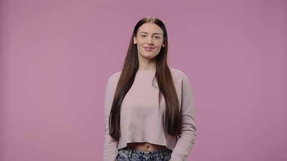 Portrait of a Beauty Model Showing Thumbs Up Gesture Like and Smiling