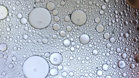 Macro view of bubbles moving through liquid