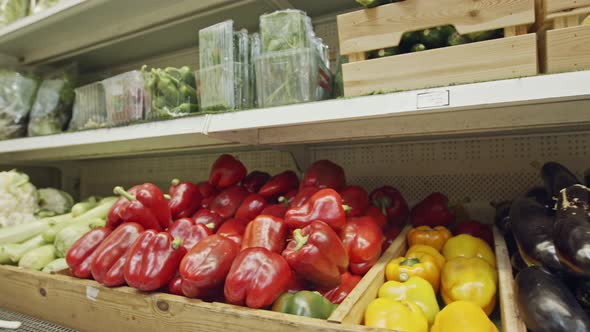 Large variety of vegetables and fruits on a supermarket shelves