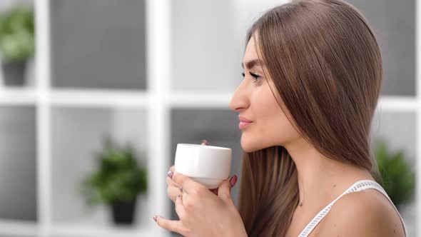 Close Up Face of Female Drink Hot Beverage Enjoying Weekend at Home