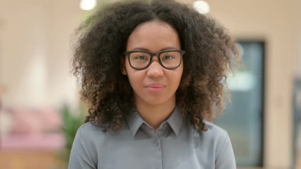 Portrait of Young African Woman Looking at the Camera