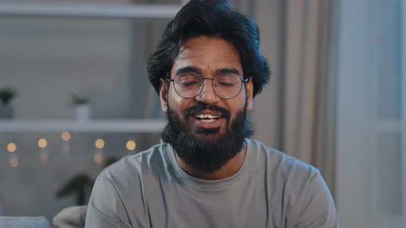 Smiling Adult 30s Indian Arabian Bearded Man Vlogger Looking at Camera Talk Make Live Video