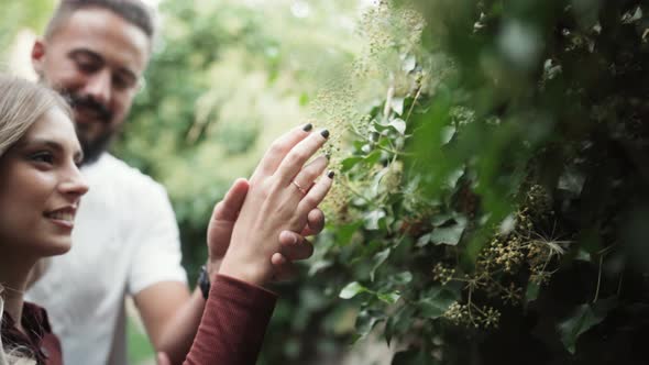 Romantic Young Couple Holding Hands While Appreciating Nature On Spring. Selective Focus