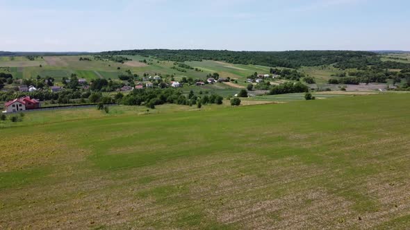 Aerial drone view of a flying over the rural agricultural landscape.