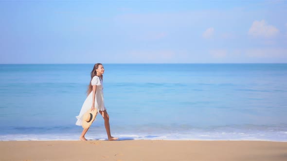 Asian woman enjoy around beautiful beach sea ocean