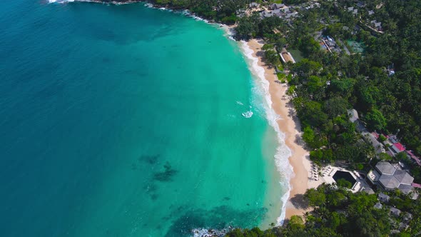 Beach aerial view. white sand beach top view. Aerial view of the beautiful sea with waves at sunny d