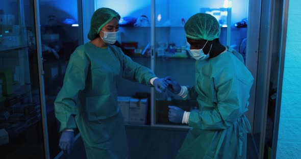 Doctors and nurse dancing in hospital during coronavirus pandemic outbreak