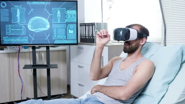 Patient in a Neuroscience Centre Wearing Vr Goggle and Making Hand Gestures