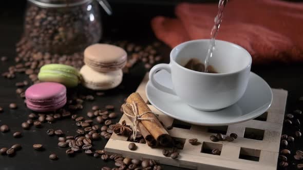 Pouring Hot Water Into a Cup with Instant Coffee