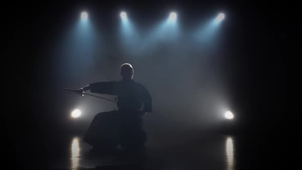 Kendo Fighter Practicing Martial Art with the Katana Sword. Slow Motion