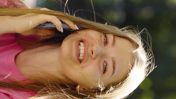 Vertical Screen Happy Woman Talking on Phone Outside