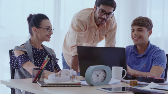 Group Meeting of Creative Business People Designer and Artist at Office Desk