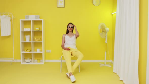 Young Woman Is Sitting and Using Mobile Phone