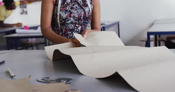 Mixed race woman working in creative office