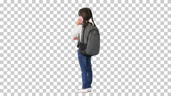 Smiling girl with backpack talking on, Alpha Channel