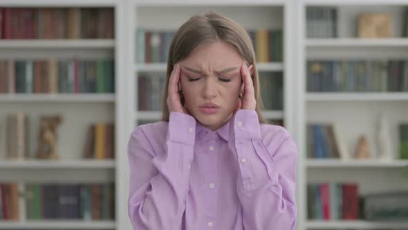 Portrait of Woman Having Headache