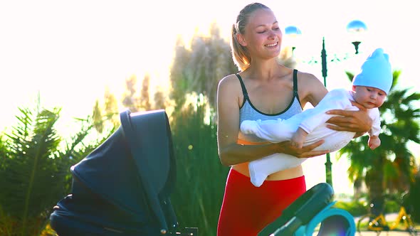 Baby in the Arms of the Mother Flying Playing a Rocket or Aircraft Airplane Outdoors