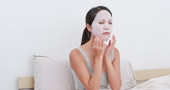 Woman use of paper mask at home