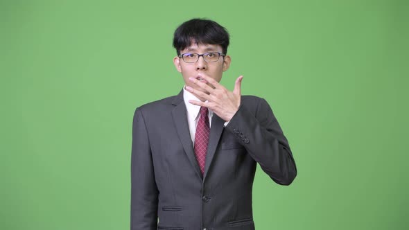 Young Asian Businessman Shocked