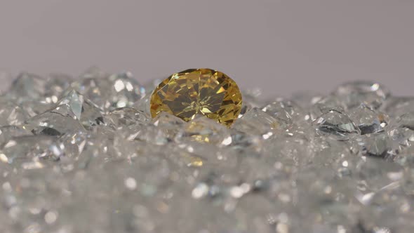 Yellow Diamond On A Pile Of White Diamonds