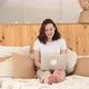 Young Attractive Girl Uses a Laptop While in Bed - VideoHive Item for Sale