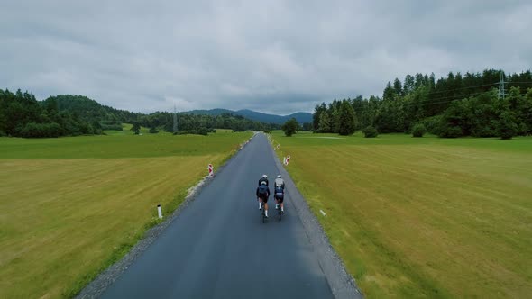 Team of Cyclists Ride in Beautiful Scenery