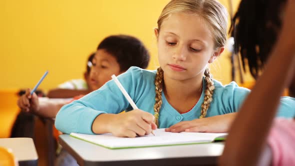 School kids studying in classroom