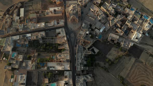 Small Town or City on Gozo, Malta Island with Church in Center in Brown and Beige Sand Color, Aerial