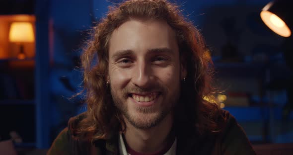 Portrait of Young Hipster Bearded Guy Smiling While Looking To Camera. Close Up View of Cheerful