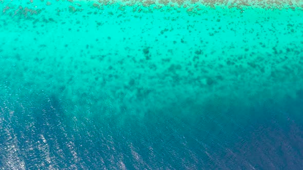 Sea Surface in a Turquoise Lagoon, Top View. Transparent Turquoise Sea Water, Natural Background