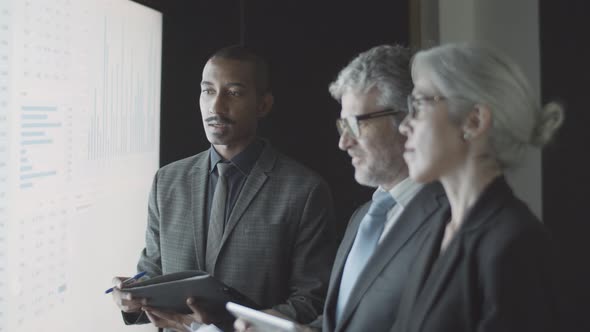 Confident Black Finance Expert Giving Consultation