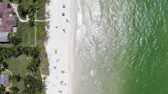 Aerial Drone View of Ocean Waves Crashing on Beach