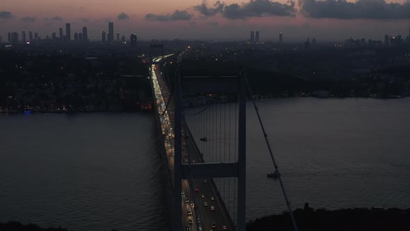 Istanbul 15 July Martyrs Bosphorus Bridge at Dusk or Night with City Skyline Silhouette and Car