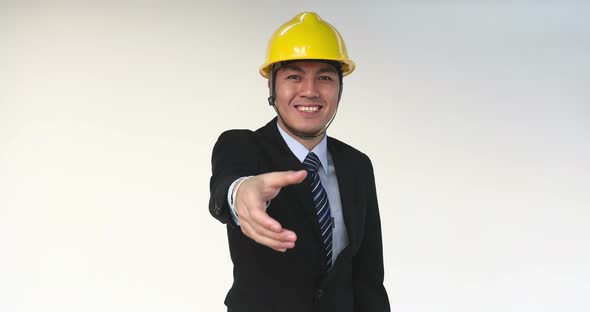 Asian Engineer with Handshake Gesture