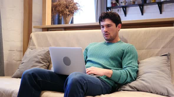 Tension and Headache Frustrated Man Working on Laptop