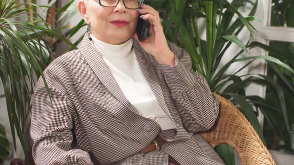 Charming Businesslady Having Rest Using Mobile Phone