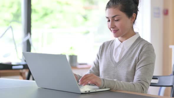 Positive Indian Businessman with Laptop Doing Thumbs Up