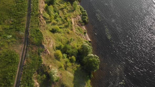 The road near the cliff above the river. Camera top view