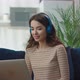 Happy Young Business Woman Wearing Headphones Talking to Laptop Making Distance Online Video - VideoHive Item for Sale