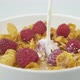 Pouring Milk On Corn Flakes With Raspberry - VideoHive Item for Sale