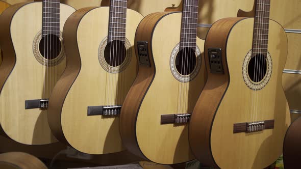 Acoustic guitars. Lots of new acoustic guitars are in music store