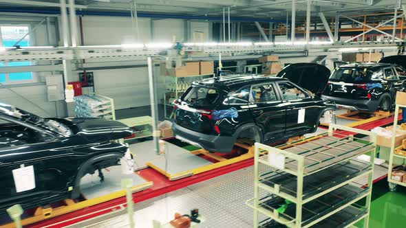 Unfinished Carcasses of Cars Kept in a Factory Unit. Automobile, Car Factory Conveyor.