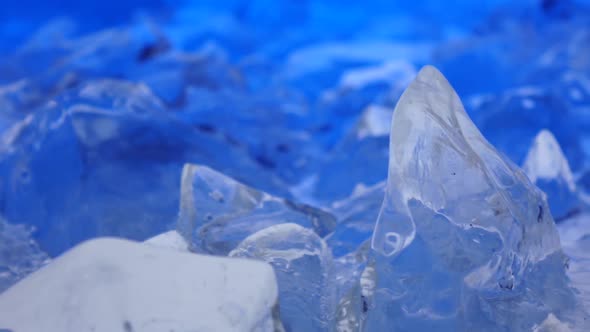 Fragments of Ice Lie on the Table, the Light Parades It. Close Up