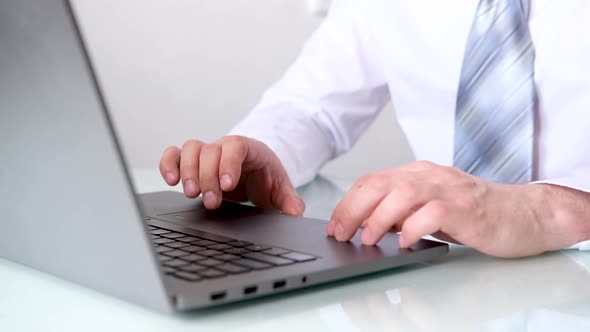 Close Up Man Hands Typing on Keyboard Notebook Computer